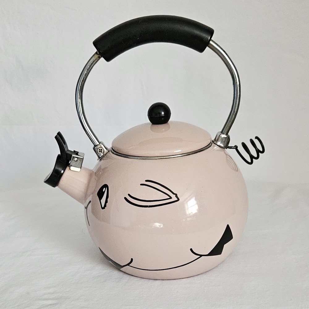 Vintage M. Kamenstein pink pig-shaped enamel whistling tea kettle. 